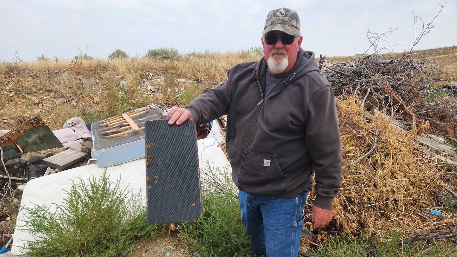 Wheatland beekeeper Pete Herman has installed an electric fence and surveillance after his hives were ransacked this week. A tuft of fur points to a hungry bear, which he fears will return to get the rest of his honey.