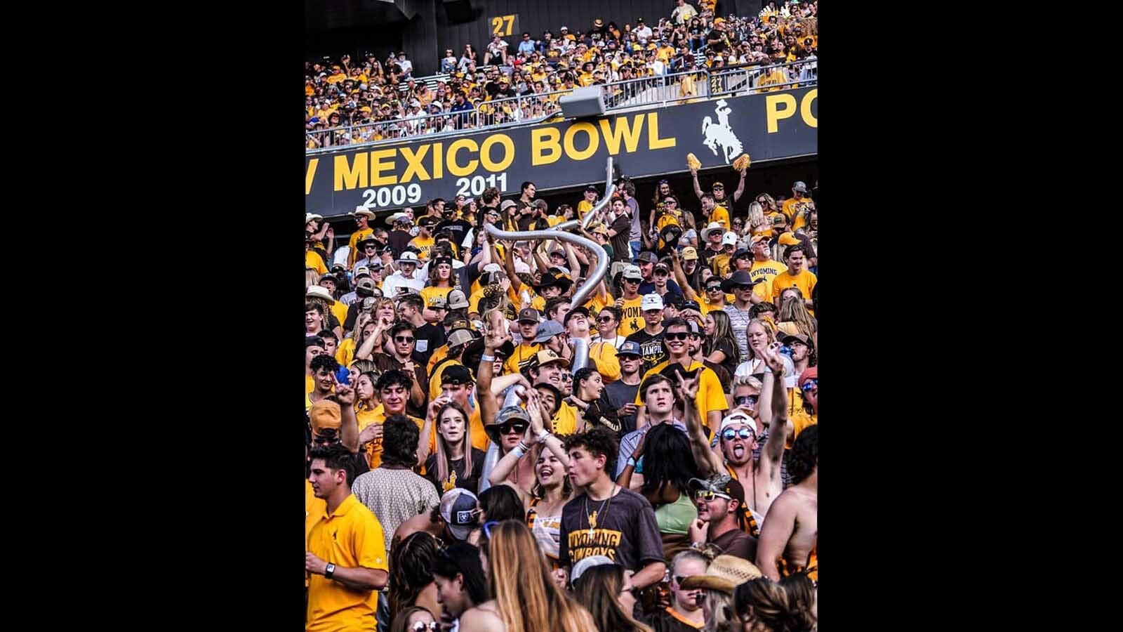 Josh Allen, left, called Jaxon Sweep’s number and challenged him to start a giant beer snake at War Memorial Stadium.