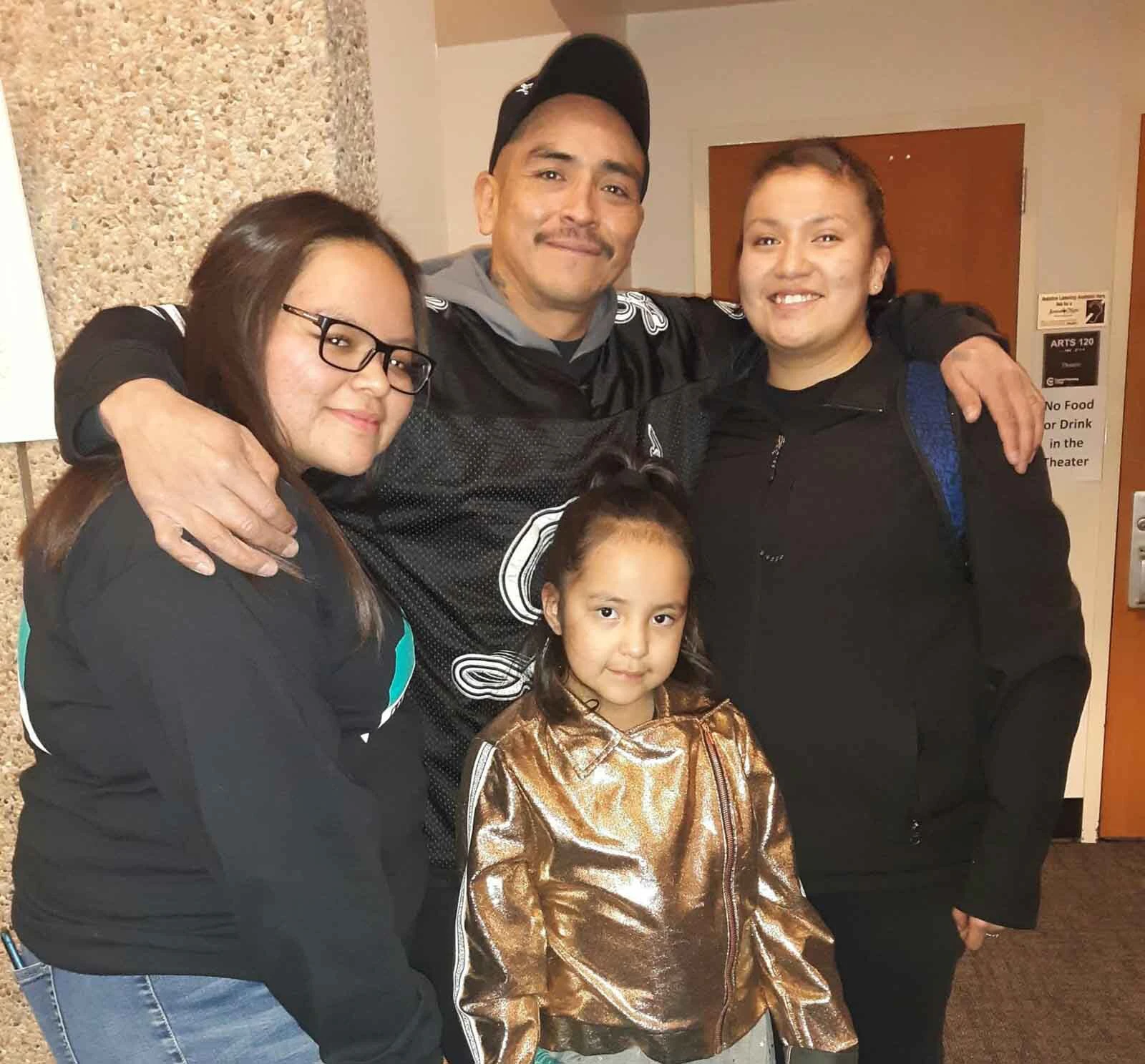 Angelina Bell with her father, Byron Bell, and family.