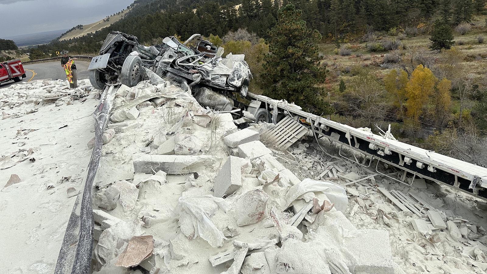 A semitrailer driver suspected of not stopping for a mandatory brake check crashed into a guardrail and spilled 40,000 pounds of bentonite on Highway 16 outside Buffalo.
