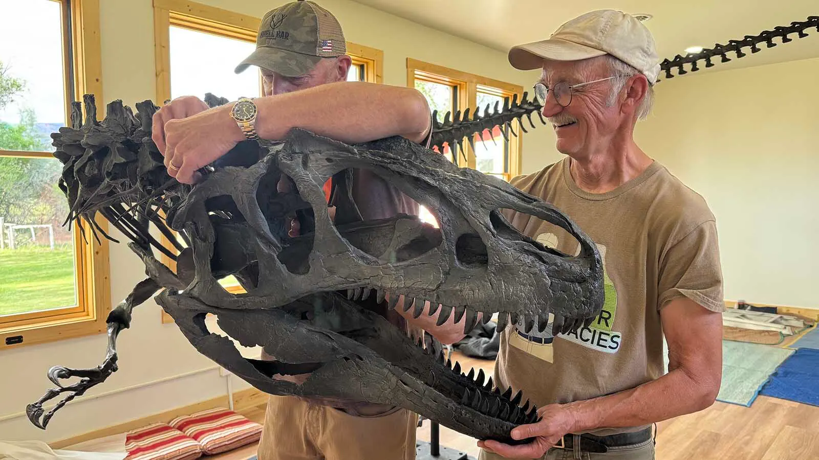 Wild West Dino Den board members Erik Kvale and Nolan Oneal attached the skull of Big Al to the rest of its skeleton. 