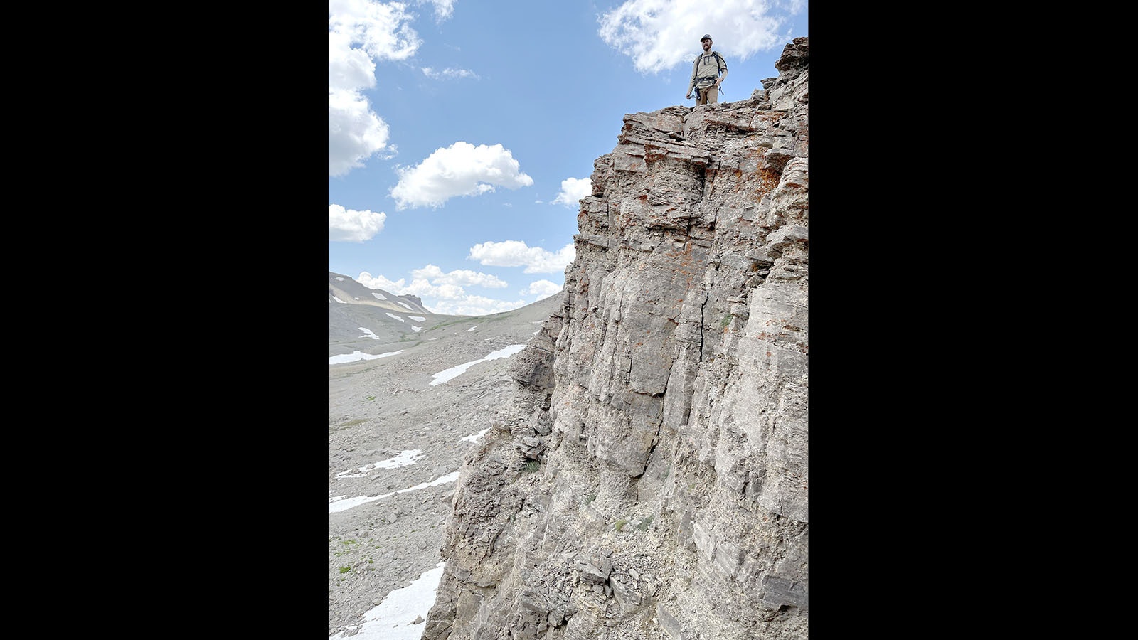Backcountry Hiker David Willms of Cheyenne stands atop a cliff overlooking a notch passage through “The Great Wall” along Wyoming’s remote “Big Balls” hiking trail.