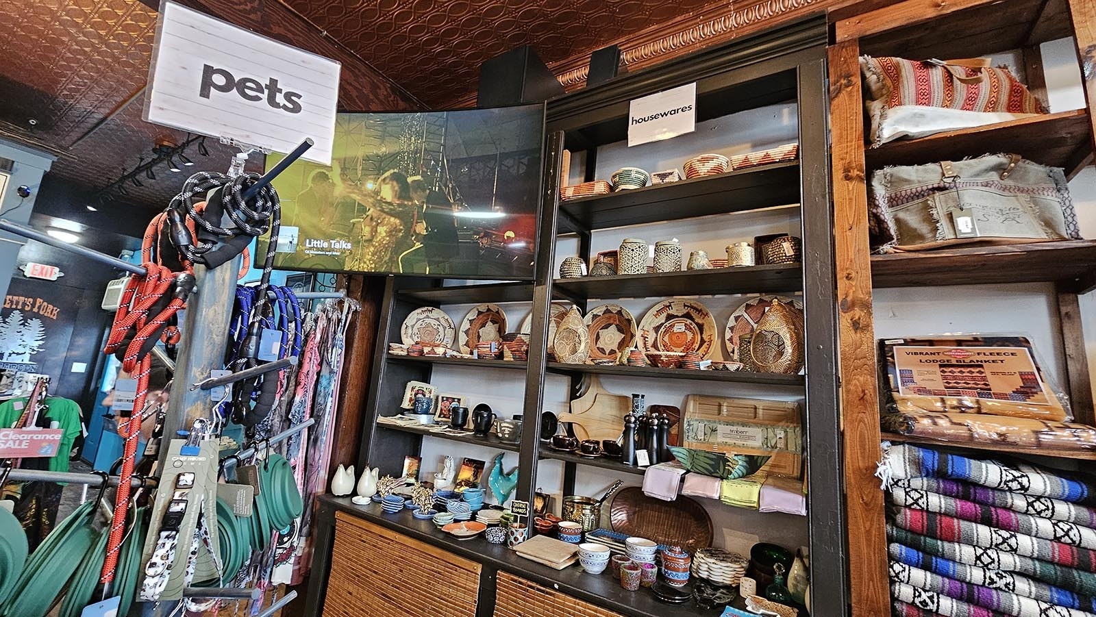 The two shelves at the end are original to the store, as is the tin stamp ceiling above them.