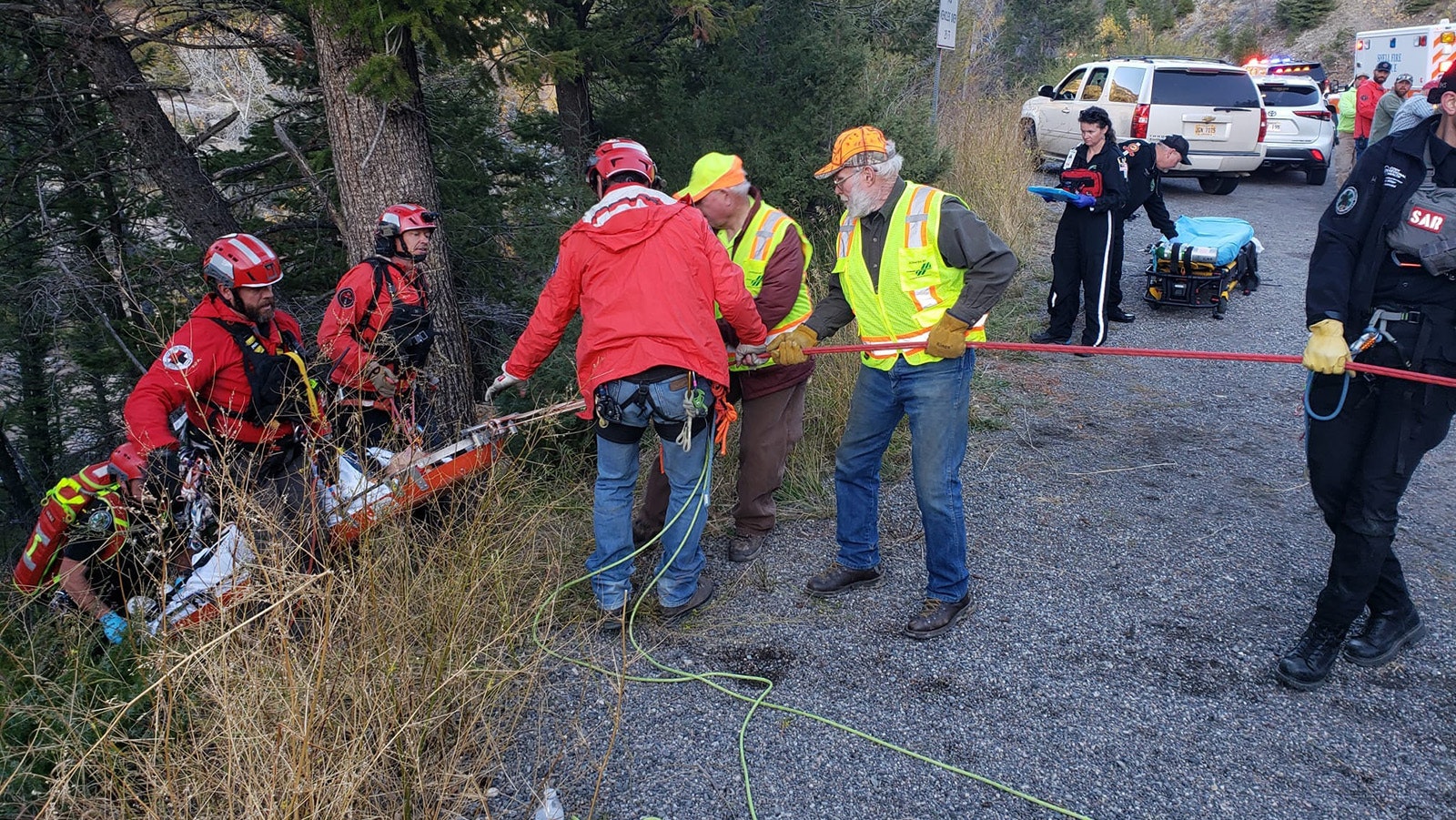 Search and rescue responders and volunteers help retrieve a woman who slipped and fell in the Shell Falls area of Big Horn County on Sunday.