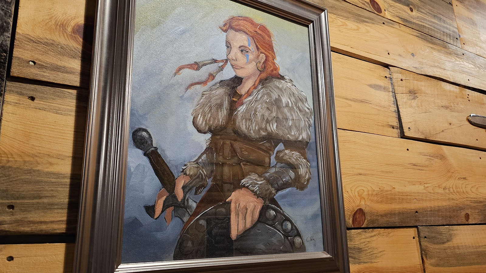 Crazy Woman points the way to the ladies room in Big Lost Meadery. She is a Viking shield maiden you don't  want to meet on the battle field — unless she's on your side.