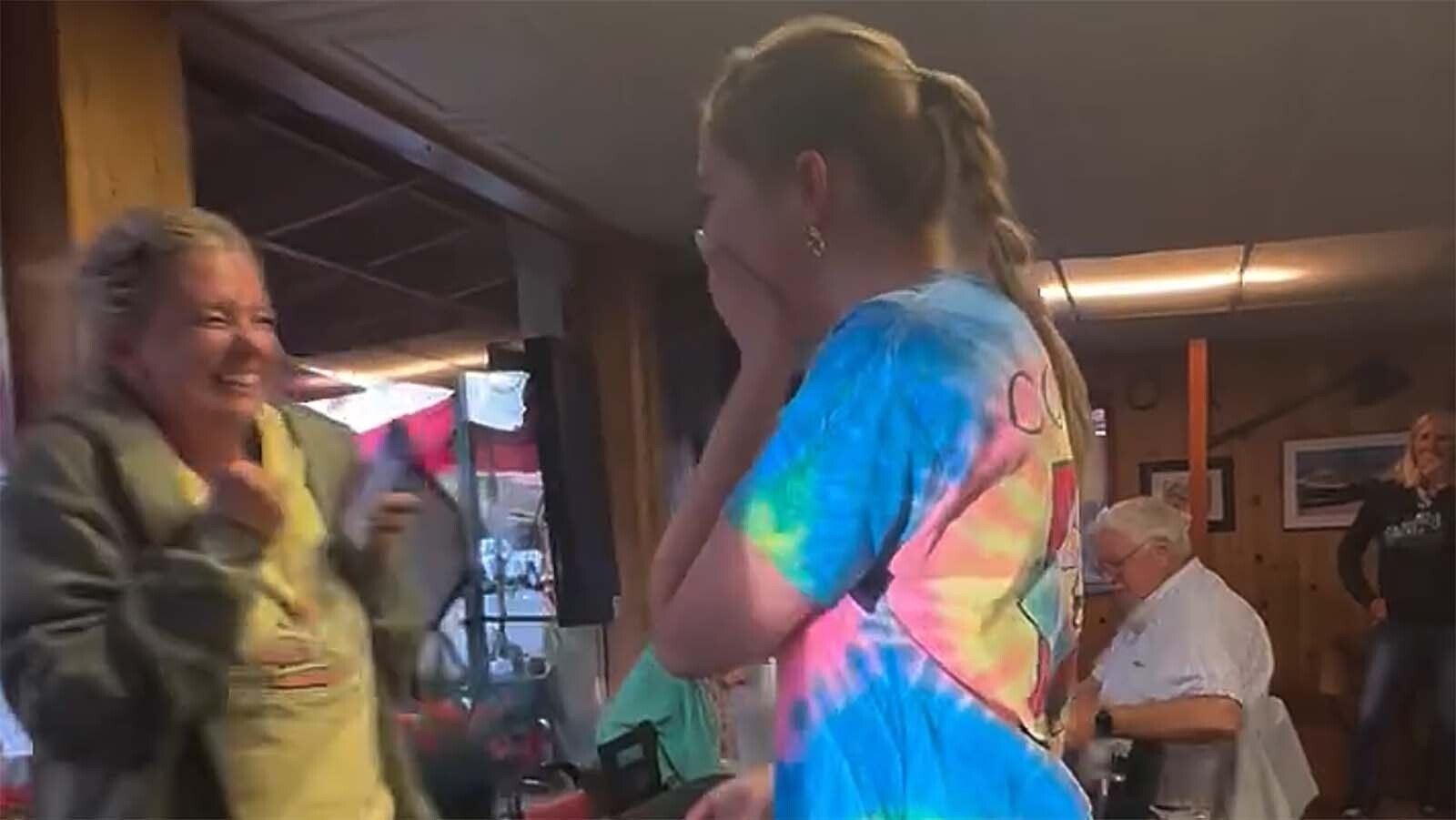 The moment Amber Seasock is told she's getting a nearly $1,500 tip for waiting on a pair of road-tripping friends in Dubois, Wyoming, on Friday, July 18, 2025.