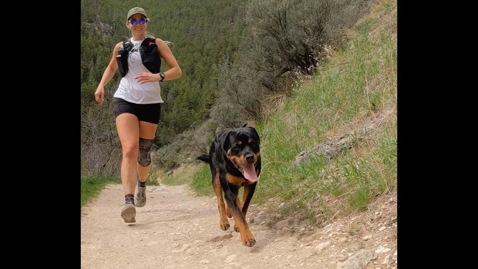 Anne Hinman trains on a Wyoming trail alongside her dog. Weekend long runs are a key part of preparing for ultramarathons like the Bighorn 100.