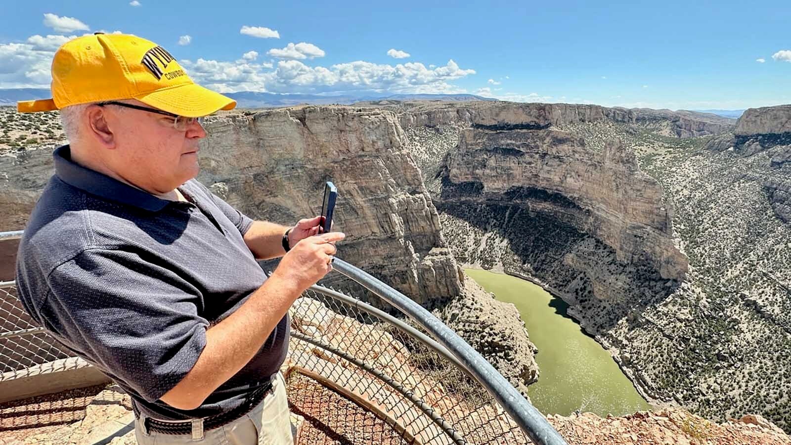 David Peck, at the visitor overlook, shoots photos of the vast Bighorn Canyon.