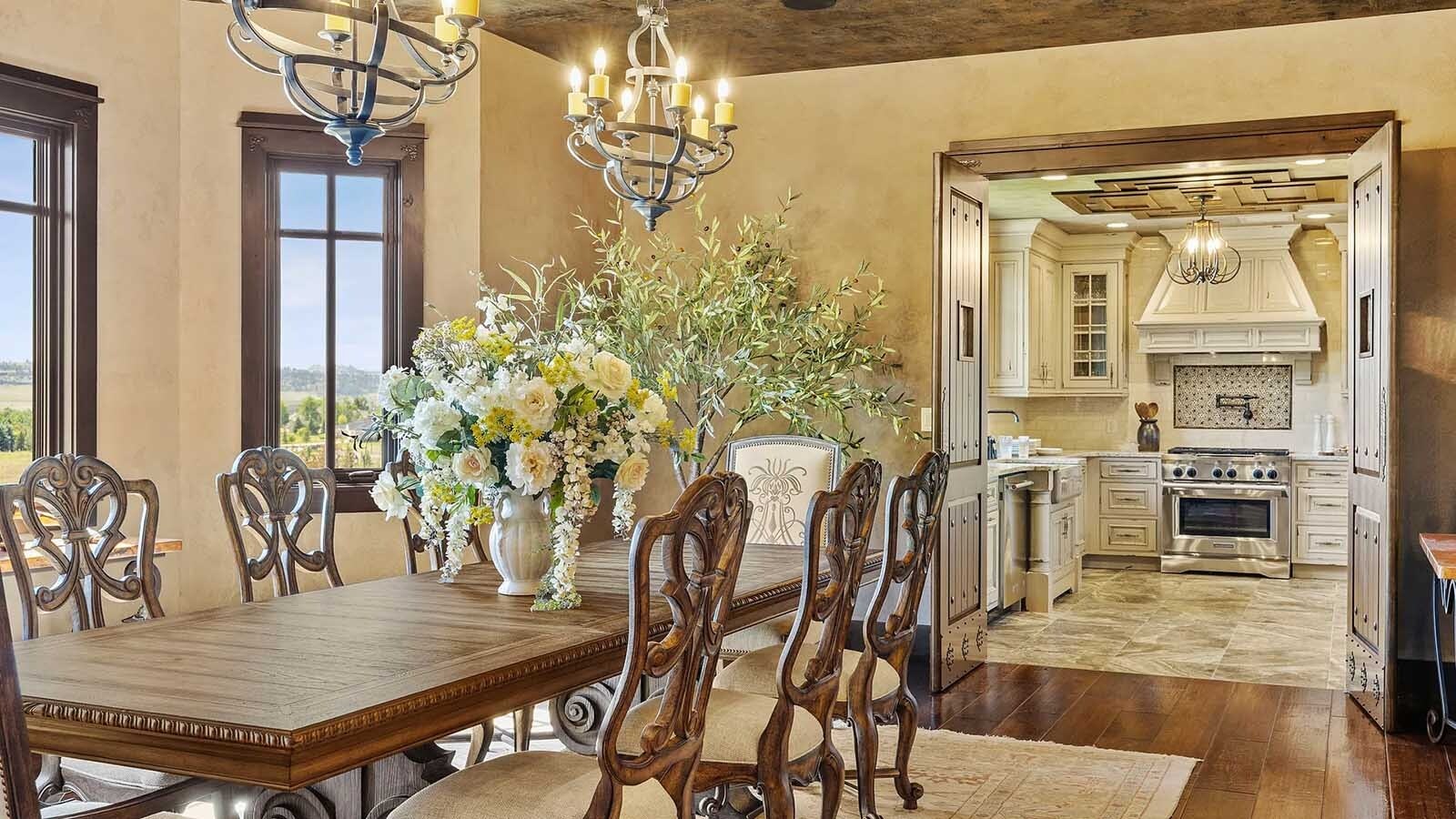 The property at 5650 Canyonwoods Drive in Billings, Montana, is described as a 30,843-square-foot stone chateau with 10 bedrooms and 19 bathrooms, situated on 98 acres. The listing mentions it's priced at $26.9 million and includes amenities like three pools, a 14-car garage, elevators, indoor shooting range, bowling alley, an outdoor 3-hole golf course and an indoor golf simulator, plus a wine cellar, workout gym and theater.