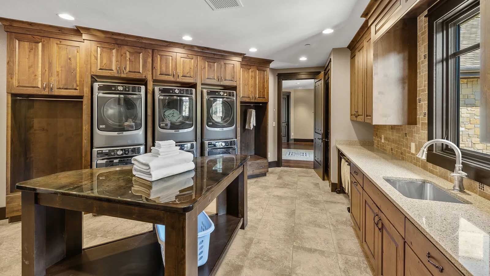 The property at 5650 Canyonwoods Drive in Billings, Montana, is described as a 30,843-square-foot stone chateau with 10 bedrooms and 19 bathrooms, situated on 98 acres. The listing mentions it's priced at $26.9 million and includes amenities like three pools, a 14-car garage, elevators, indoor shooting range, bowling alley, an outdoor 3-hole golf course and an indoor golf simulator, plus a wine cellar, workout gym and theater.