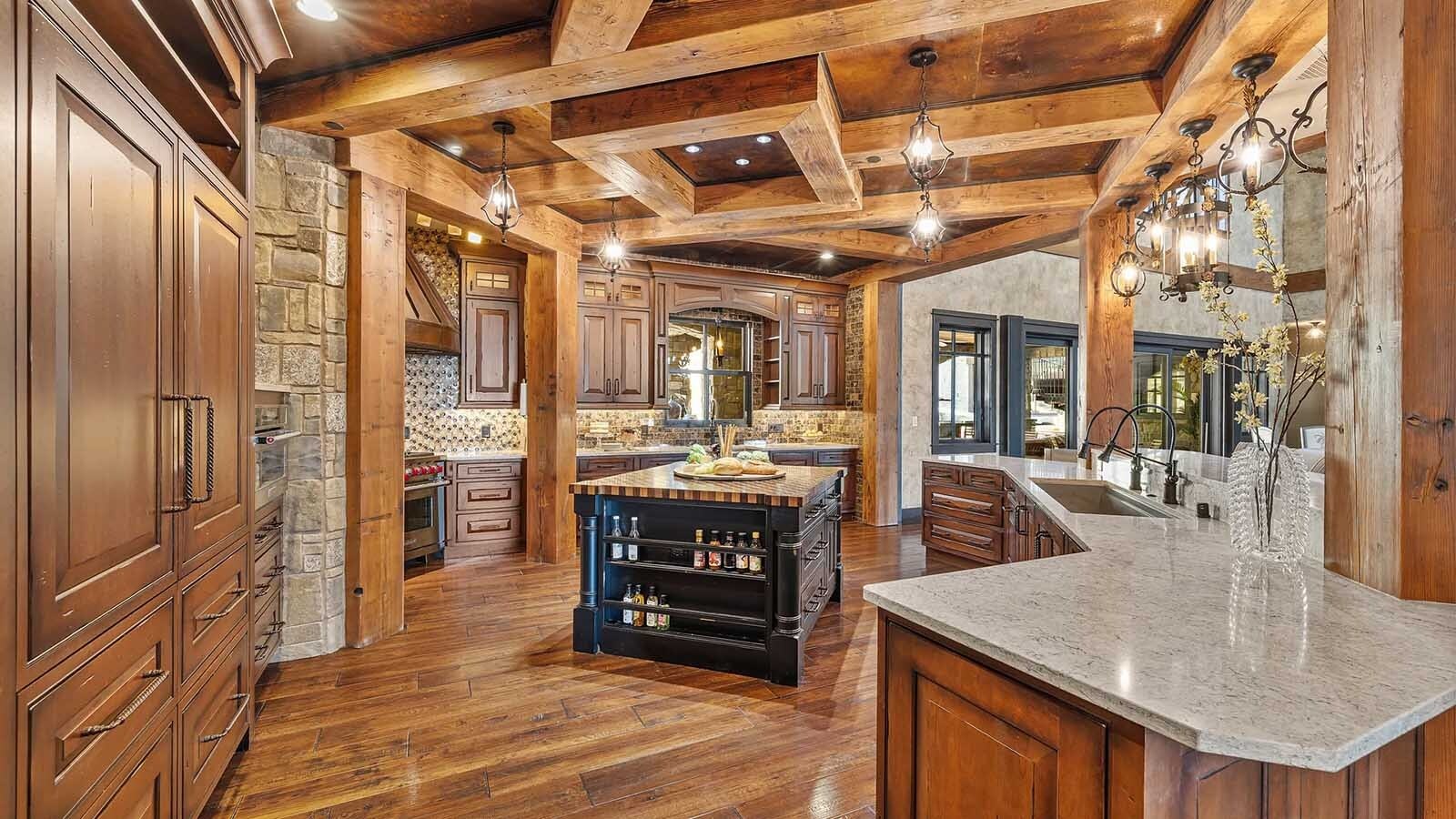 The property at 5650 Canyonwoods Drive in Billings, Montana, is described as a 30,843-square-foot stone chateau with 10 bedrooms and 19 bathrooms, situated on 98 acres. The listing mentions it's priced at $26.9 million and includes amenities like three pools, a 14-car garage, elevators, indoor shooting range, bowling alley, an outdoor 3-hole golf course and an indoor golf simulator, plus a wine cellar, workout gym and theater.
