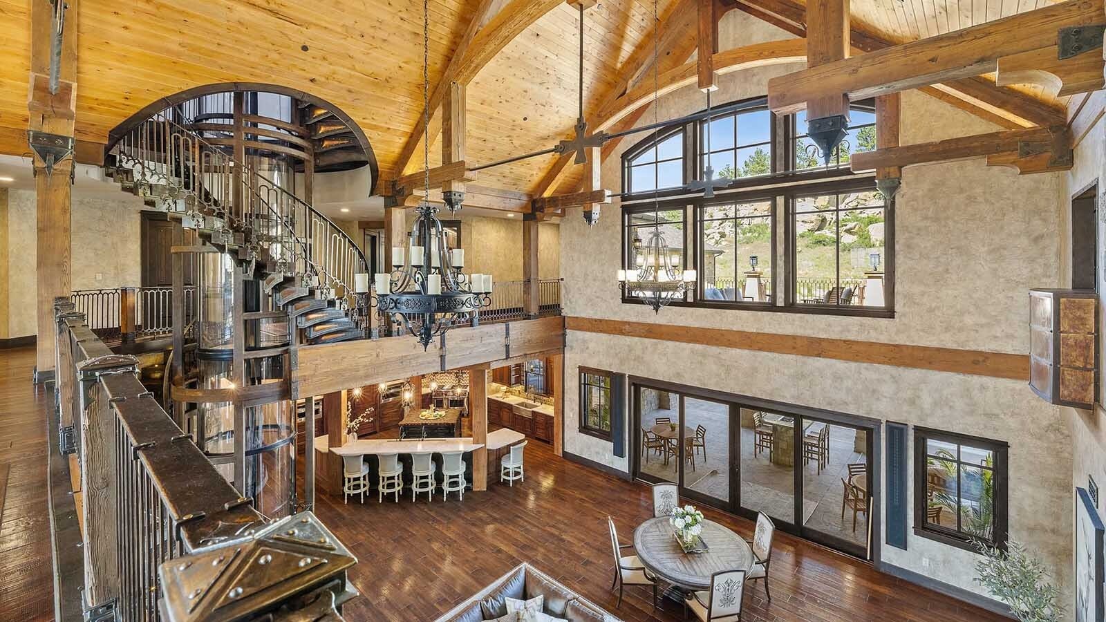 The property at 5650 Canyonwoods Drive in Billings, Montana, is described as a 30,843-square-foot stone chateau with 10 bedrooms and 19 bathrooms, situated on 98 acres. The listing mentions it's priced at $26.9 million and includes amenities like three pools, a 14-car garage, elevators, indoor shooting range, bowling alley, an outdoor 3-hole golf course and an indoor golf simulator, plus a wine cellar, workout gym and theater.