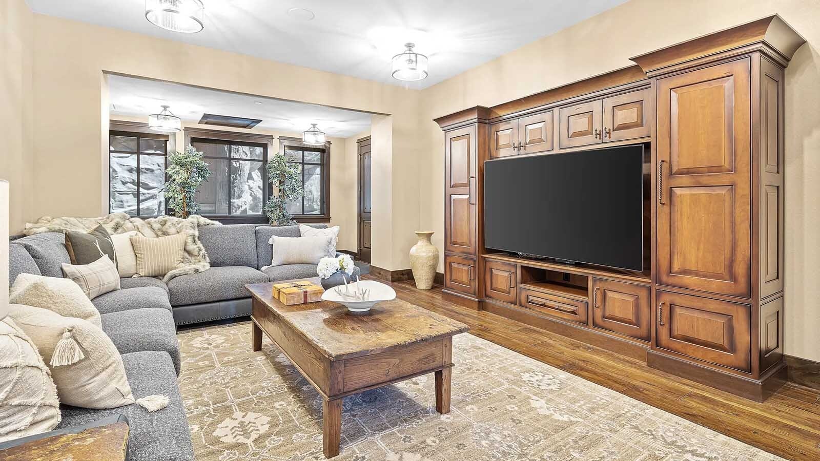 The property at 5650 Canyonwoods Drive in Billings, Montana, is described as a 30,843-square-foot stone chateau with 10 bedrooms and 19 bathrooms, situated on 98 acres. The listing mentions it's priced at $26.9 million and includes amenities like three pools, a 14-car garage, elevators, indoor shooting range, bowling alley, an outdoor 3-hole golf course and an indoor golf simulator, plus a wine cellar, workout gym and theater.