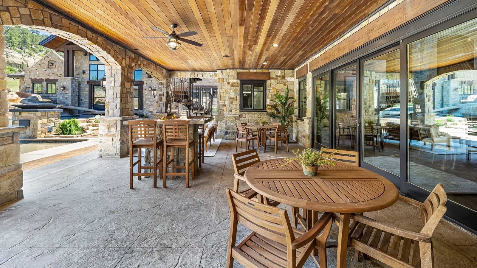 The property at 5650 Canyonwoods Drive in Billings, Montana, is described as a 30,843-square-foot stone chateau with 10 bedrooms and 19 bathrooms, situated on 98 acres. The listing mentions it's priced at $26.9 million and includes amenities like three pools, a 14-car garage, elevators, indoor shooting range, bowling alley, an outdoor 3-hole golf course and an indoor golf simulator, plus a wine cellar, workout gym and theater.