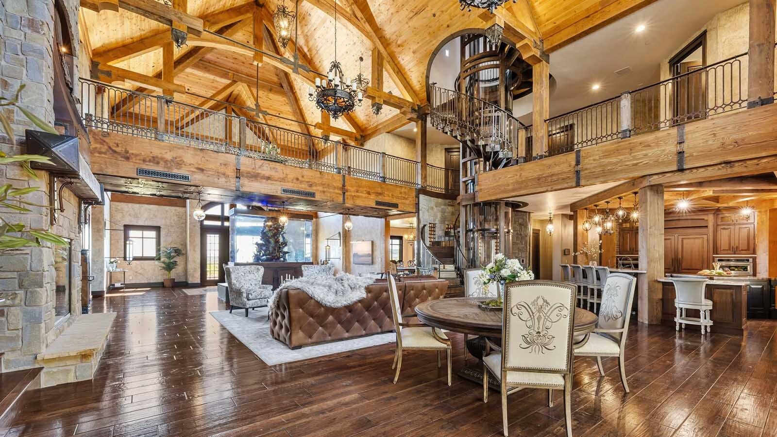 The property at 5650 Canyonwoods Drive in Billings, Montana, is described as a 30,843-square-foot stone chateau with 10 bedrooms and 19 bathrooms, situated on 98 acres. The listing mentions it's priced at $26.9 million and includes amenities like three pools, a 14-car garage, elevators, indoor shooting range, bowling alley, an outdoor 3-hole golf course and an indoor golf simulator, plus a wine cellar, workout gym and theater.