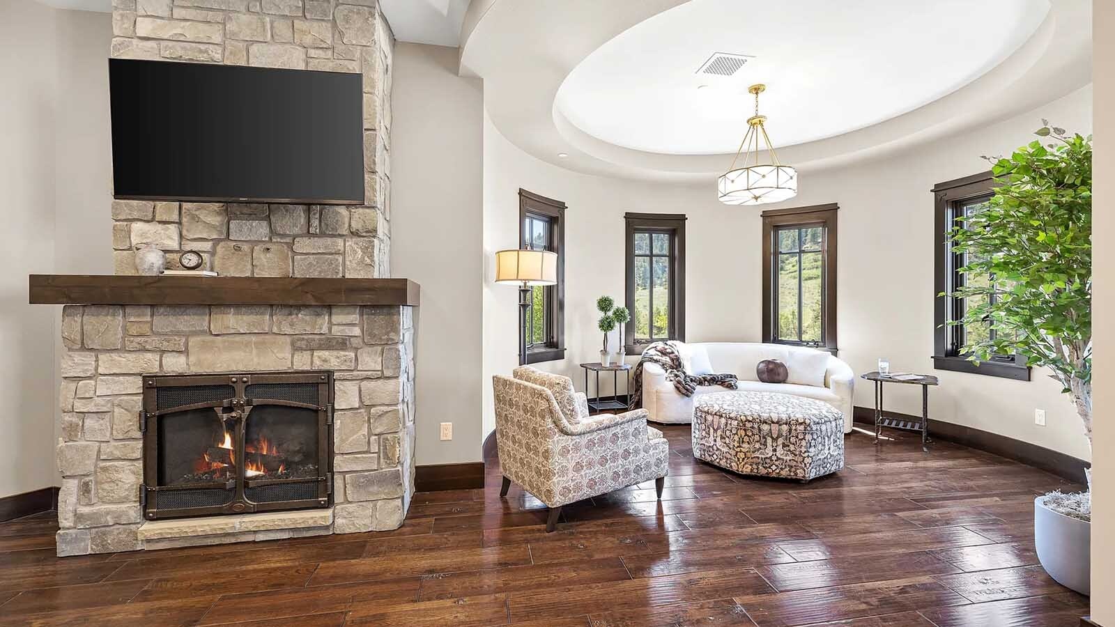 The property at 5650 Canyonwoods Drive in Billings, Montana, is described as a 30,843-square-foot stone chateau with 10 bedrooms and 19 bathrooms, situated on 98 acres. The listing mentions it's priced at $26.9 million and includes amenities like three pools, a 14-car garage, elevators, indoor shooting range, bowling alley, an outdoor 3-hole golf course and an indoor golf simulator, plus a wine cellar, workout gym and theater.