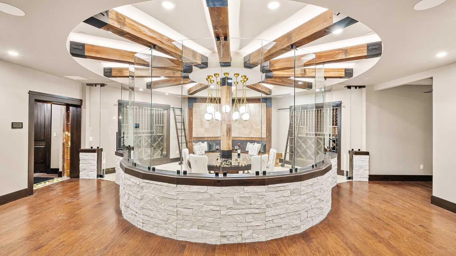 The property at 5650 Canyonwoods Drive in Billings, Montana, is described as a 30,843-square-foot stone chateau with 10 bedrooms and 19 bathrooms, situated on 98 acres. The listing mentions it's priced at $26.9 million and includes amenities like three pools, a 14-car garage, elevators, indoor shooting range, bowling alley, an outdoor 3-hole golf course and an indoor golf simulator, plus a wine cellar, workout gym and theater.