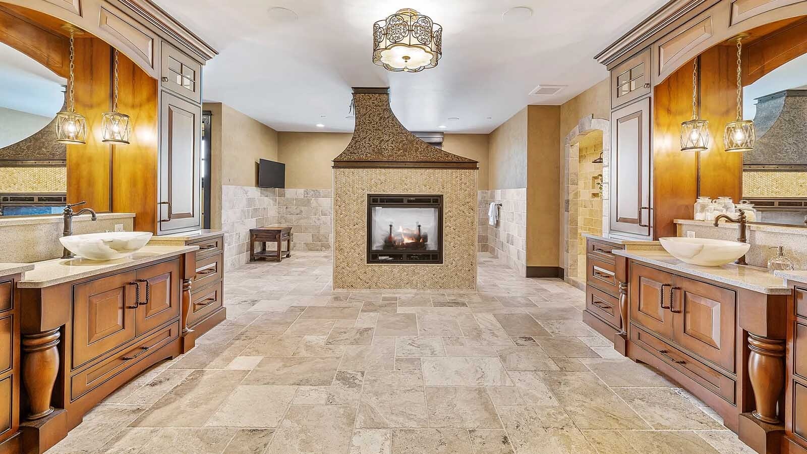 The property at 5650 Canyonwoods Drive in Billings, Montana, is described as a 30,843-square-foot stone chateau with 10 bedrooms and 19 bathrooms, situated on 98 acres. The listing mentions it's priced at $26.9 million and includes amenities like three pools, a 14-car garage, elevators, indoor shooting range, bowling alley, an outdoor 3-hole golf course and an indoor golf simulator, plus a wine cellar, workout gym and theater.