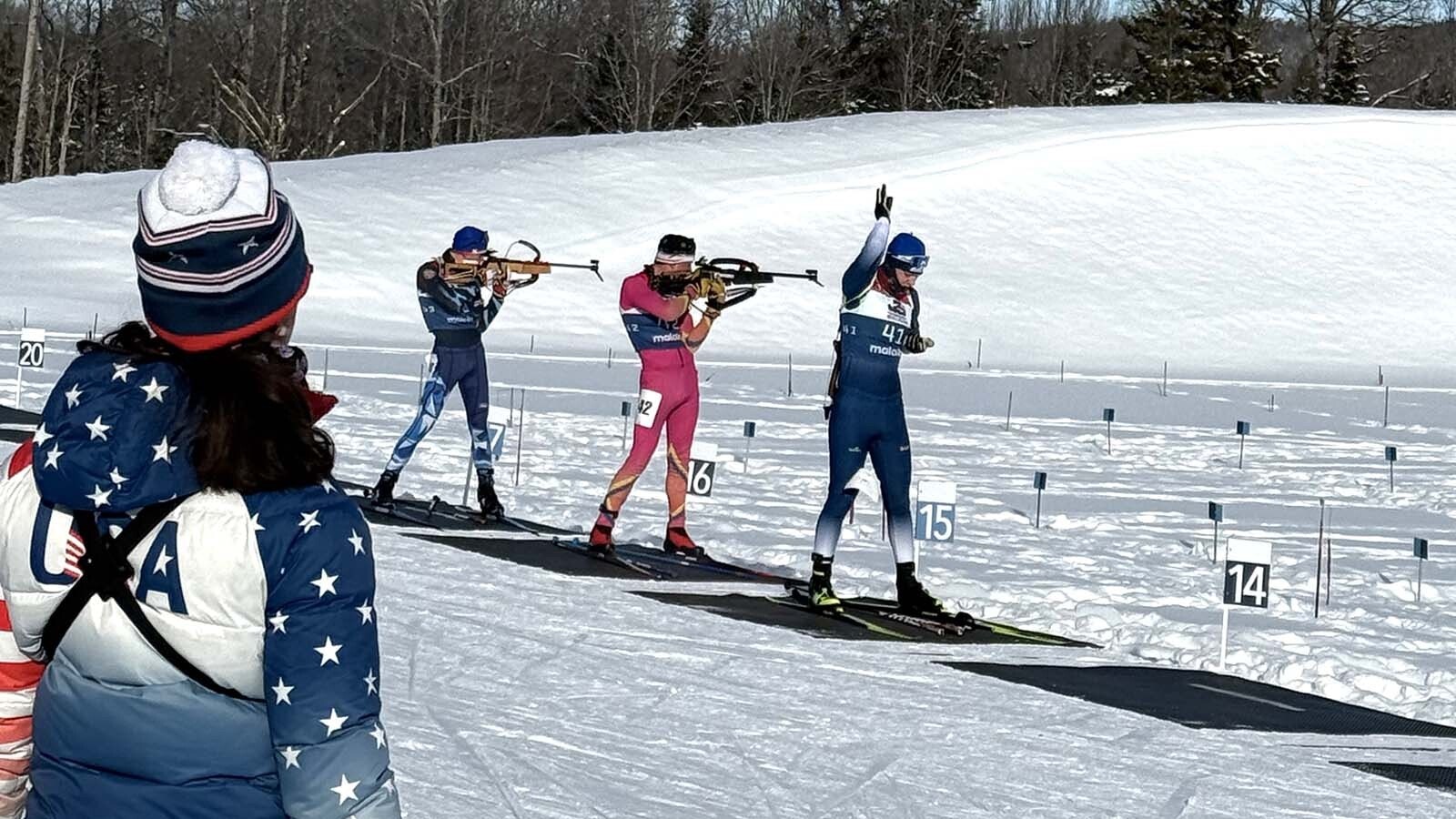 Darin Binning Jr. in red takes a shot at his target while competing in a race at Lake Placid, New York, in December.