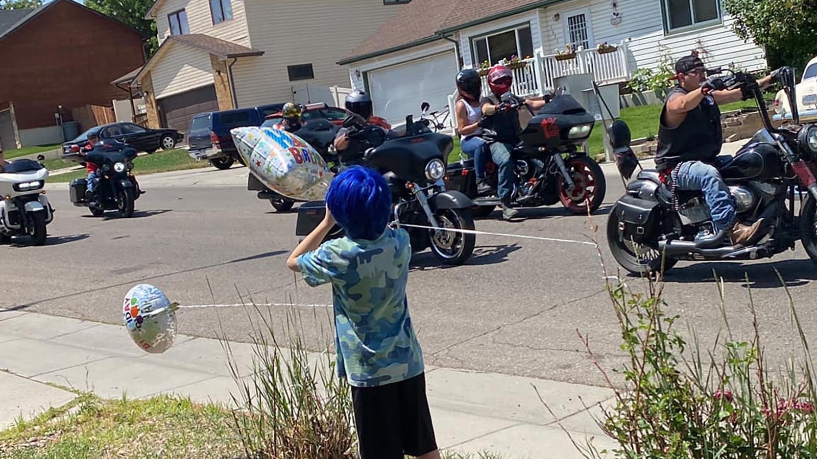 An impromptu call for people to drive by the home of a Rock Springs boy on his 10th birthday rallied more than 100 cars and motorcycles Sunday, July 21, 2024.