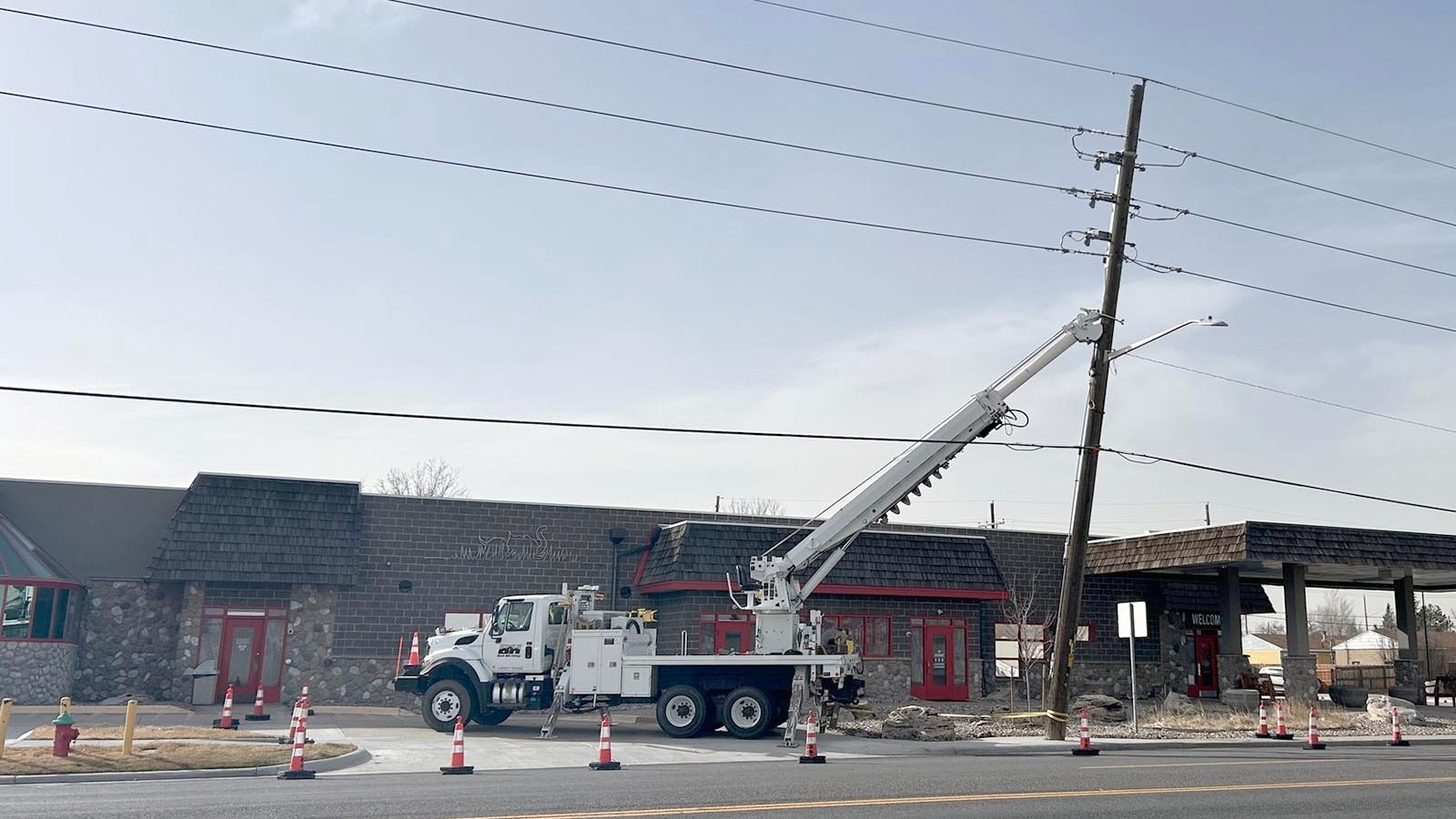 Crews from Black Hills Energy repair broken power poles and downed power lines in and around Cheyenne on Thursday, March 12, 2026.
