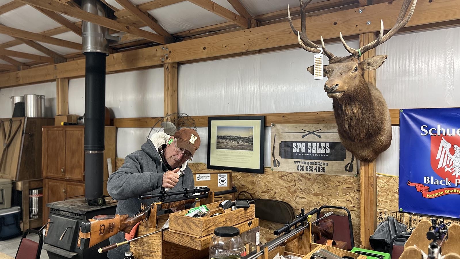 Dick Hennebry of Cheyenne tends to his rifle between rounds of shooting at the Smithmoor BPCR Range near Carpenter on Thursday.