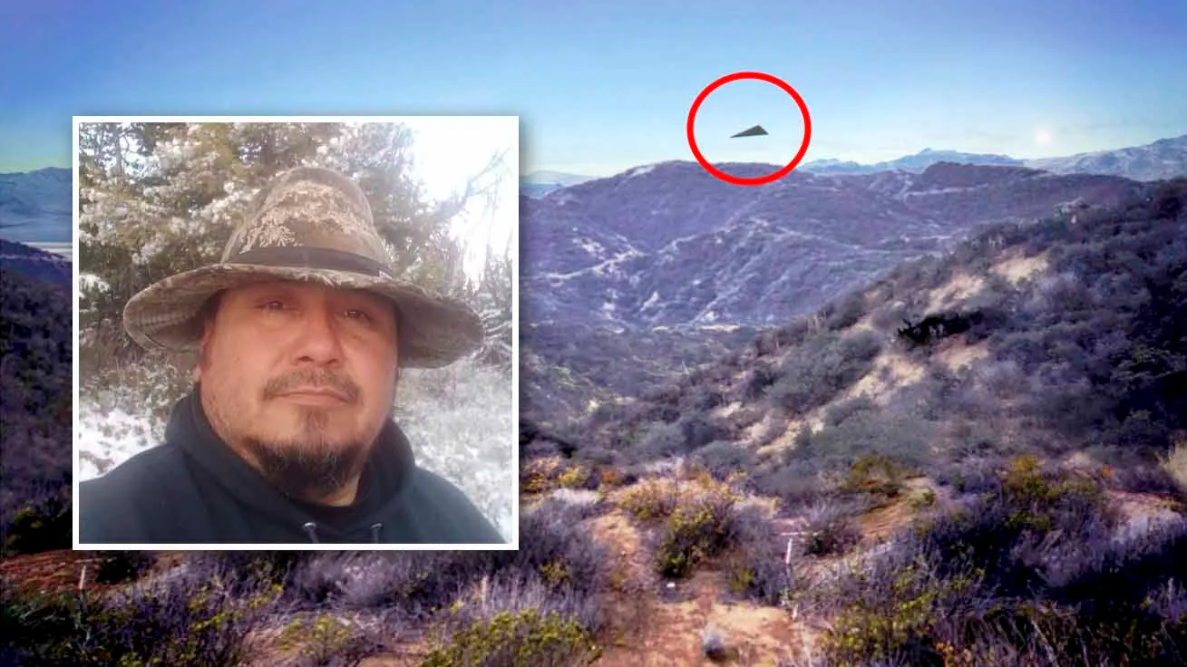 Gary Medicine Cloud, a hunter from the Wind River Reservation, recounted his 2003 encounter with a silent, matte-black triangular object in the St. Lawrence area of the Wind River Range. Background image is a digital recreation based on recently declassified federal UAP incident reports illustrates a matte-black triangular craft observed executing low-altitude maneuvers over Western military airspace.