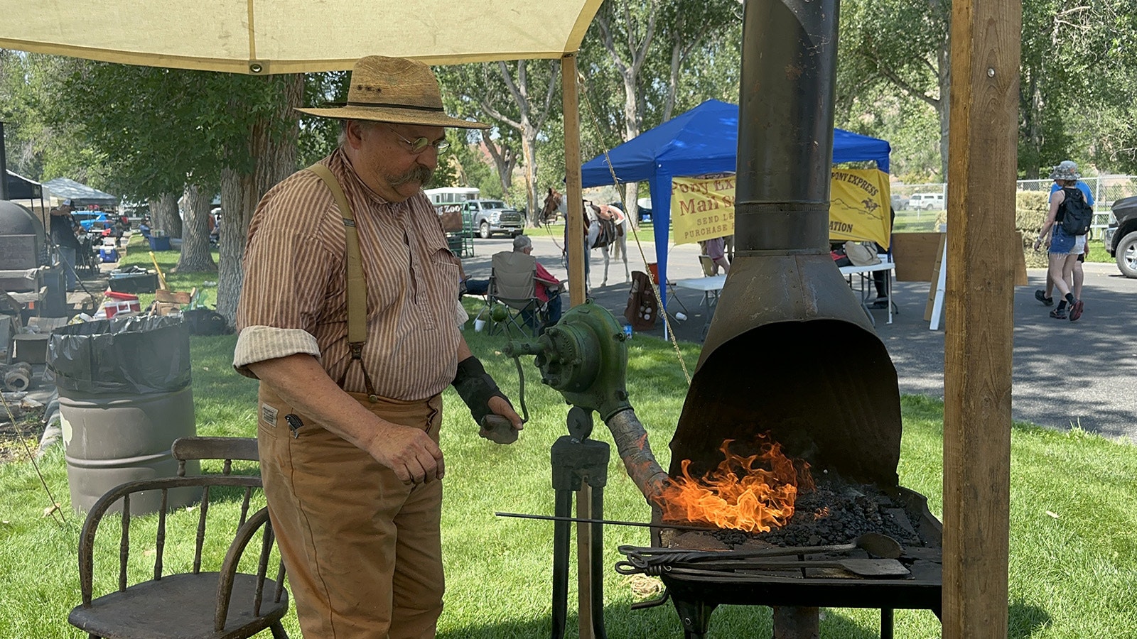 Blacksmith David Osmundsen heats up his hand forge at the Wyoming Discovery Days in Thermopolis.