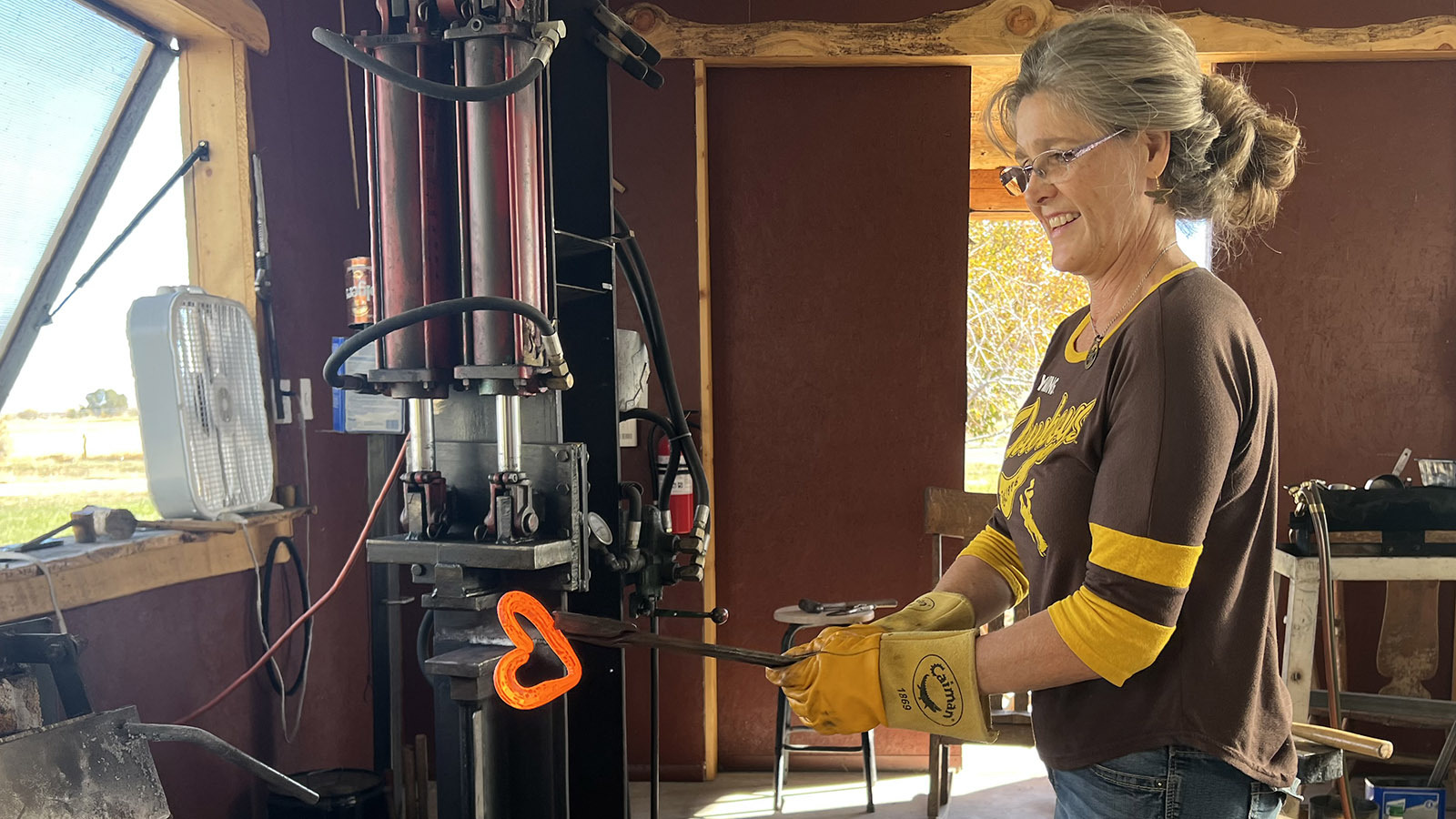 Master bladesmith Audra Draper of Riverton specializes in making knives. She also makes other metal products, such as this trivet, forged from an old horseshoe.