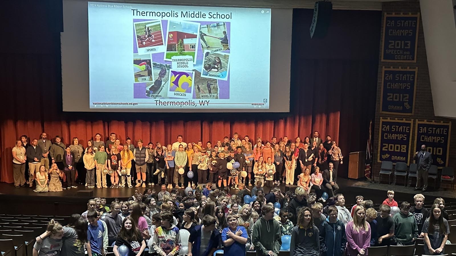 Thermopolis Middle School Assembly, 187 students strong, pose during the announcement of their school being honored as a Blue Ribbon School.