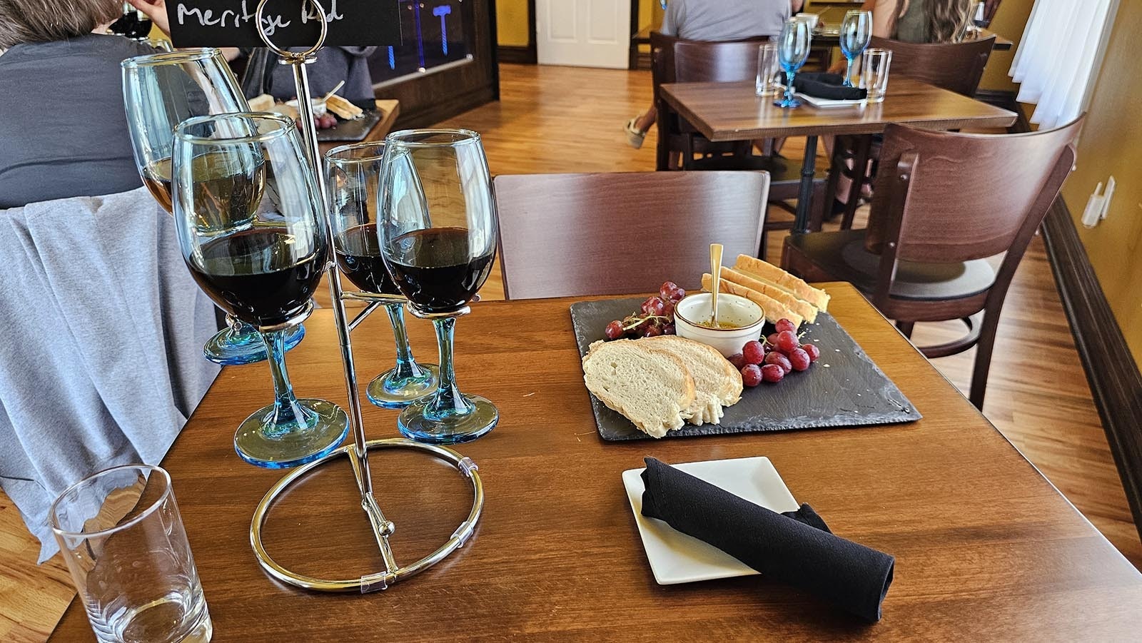 Sunday charcuterie trays are what Virginia Erdmann calls the Communion Package. It's bread, tapenade, and grapes. During the week there are also cheeses and meats.