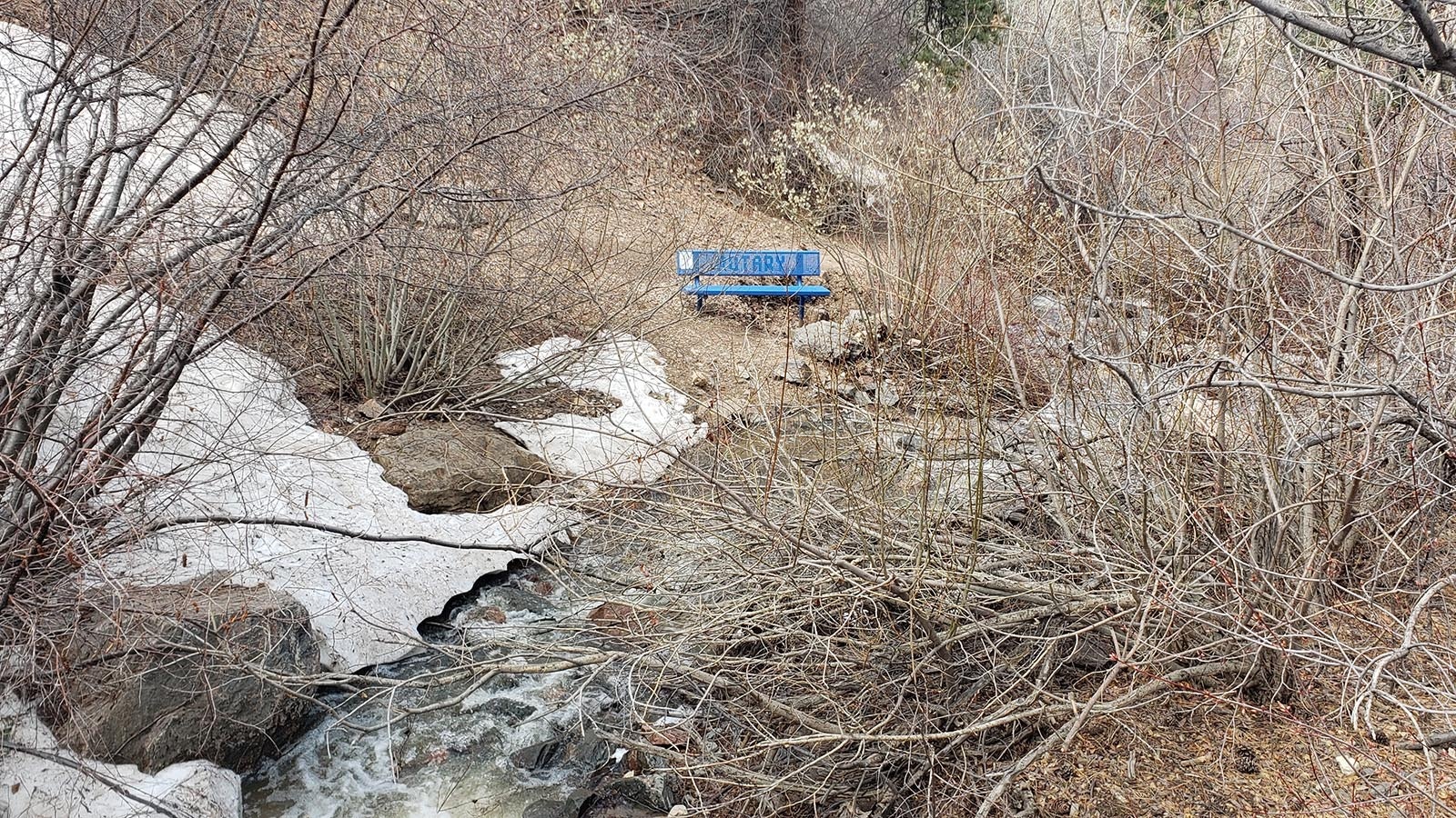 Blue benches dot the hike to the waterfall.