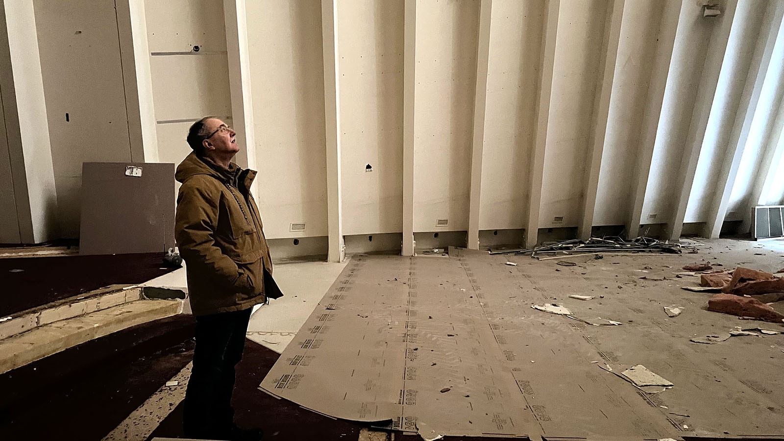 Pastor Eric Feuerstein stands inside the abandoned sanctuary of the First United Methodist Church in Laramie on Thursday. The unique, 90-foot-tall structure is set to be demolished soon.