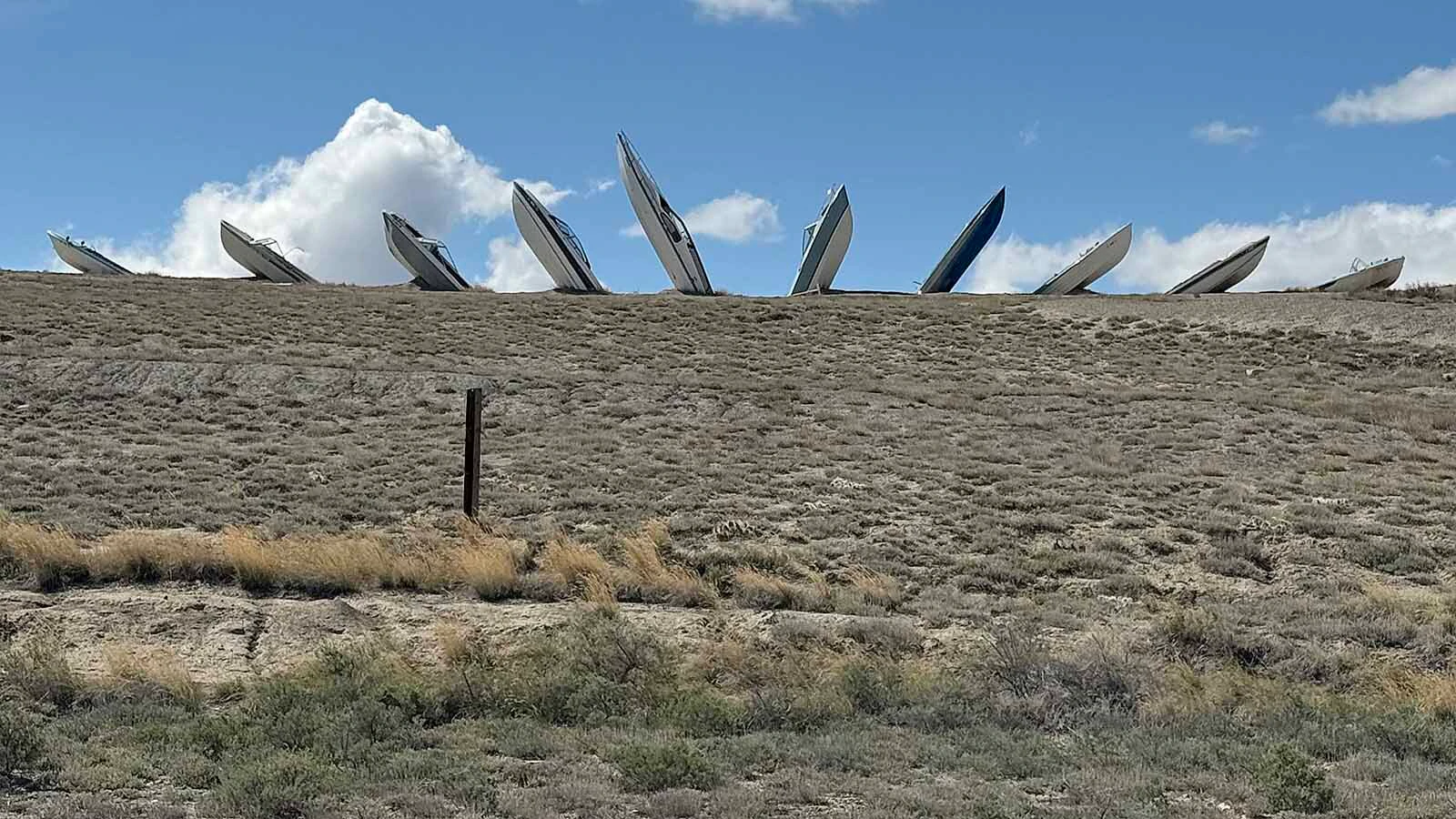 Hull’s Half Acre — many people call it “Boathenge” — gained notoriety when a row of half-buried boats appeared in the middle of nowhere outside Frannie, Wyoming, in 2020. The guy who put it there has a message for those who don’t like it: “Go to hell."