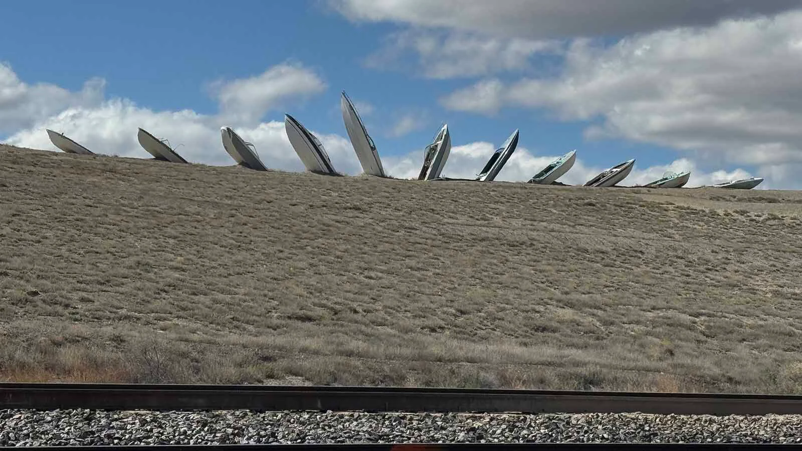Hull’s Half Acre — many people call it “Boathenge” — gained notoriety when a row of half-buried boats appeared in the middle of nowhere outside Frannie, Wyoming, in 2020. The guy who put it there has a message for those who don’t like it: “Go to hell."