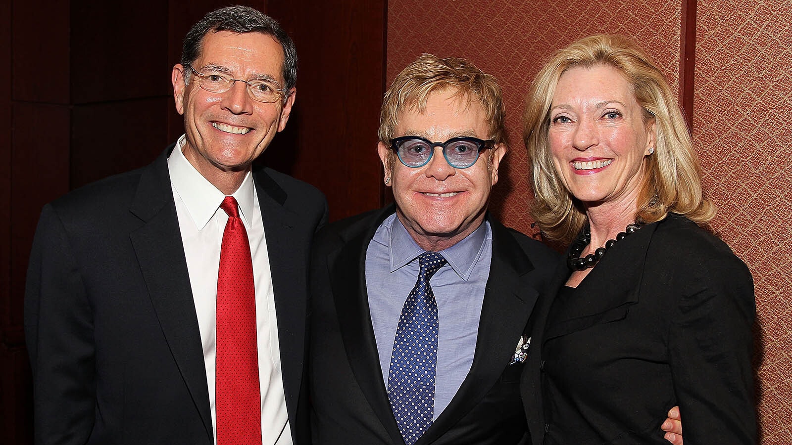 Bobbi Barrasso with her husband, U.S. Sen. John Barrasso, and Elton John before an event for John's AIDS foundation.