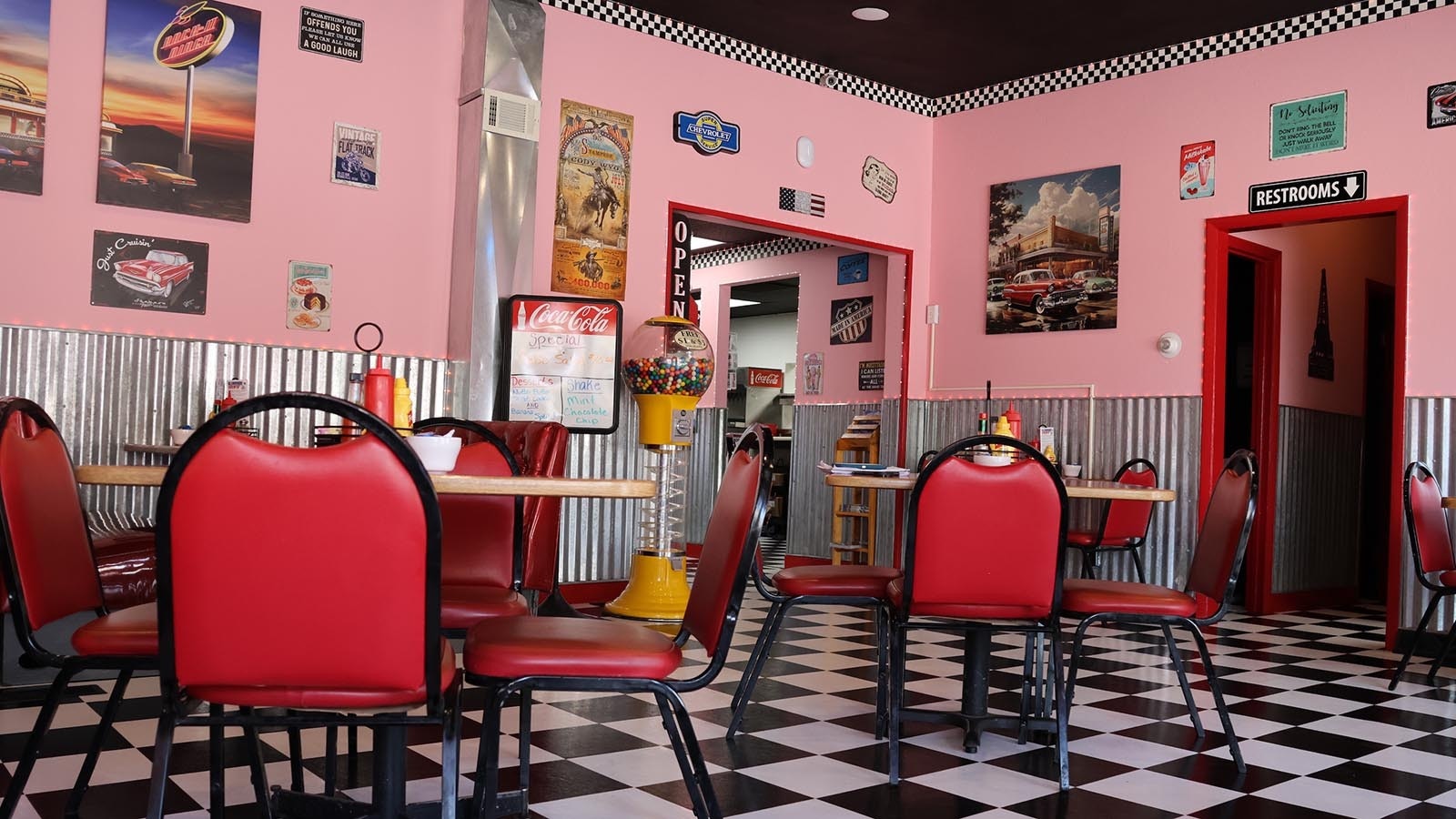 The interior of the diner has been remodeled with new flooring and period posters and signs bought at antique stores.