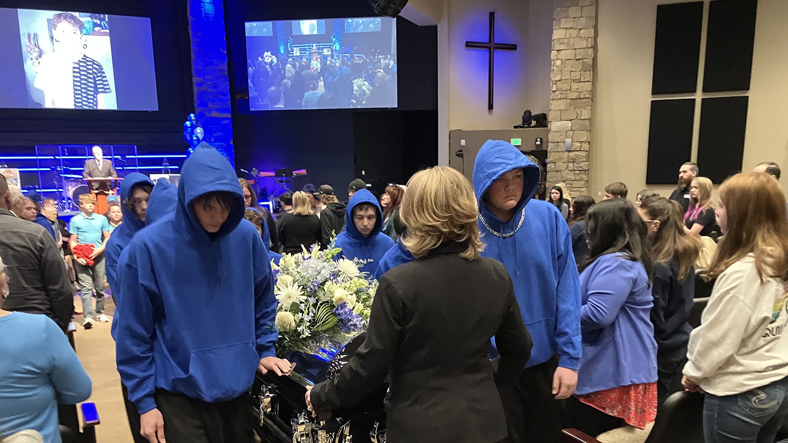 Bobby Maher’s brothers and friends served as pallbearers for his casket as the teen’s body was escorted out of the funeral service.