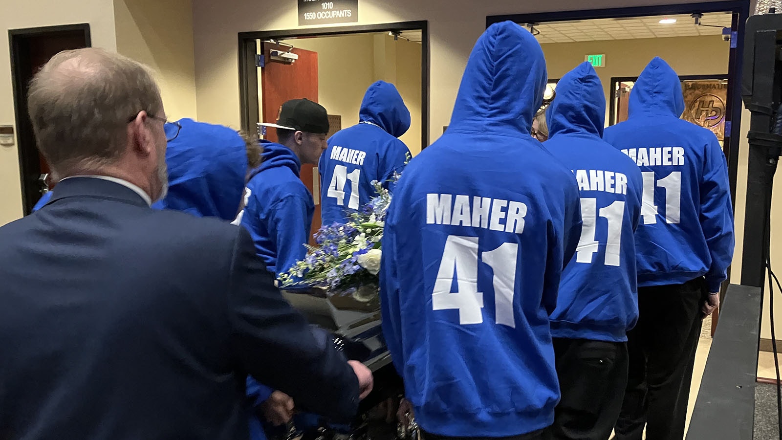 Bobby Maher’s pallbearers, who included his brothers and friends, all word blue hooded sweatshirts with his name and baseball jersey number, “41.”