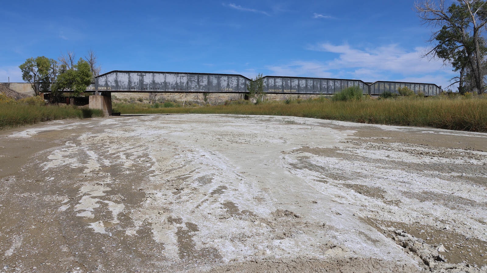 Badwater Creek contained no moisture during a Cowboy State Daily visit. But in July and September of 1923 it was a destroying torrent that took out bridges and sent box cars down the creek bed to be swallowed up.