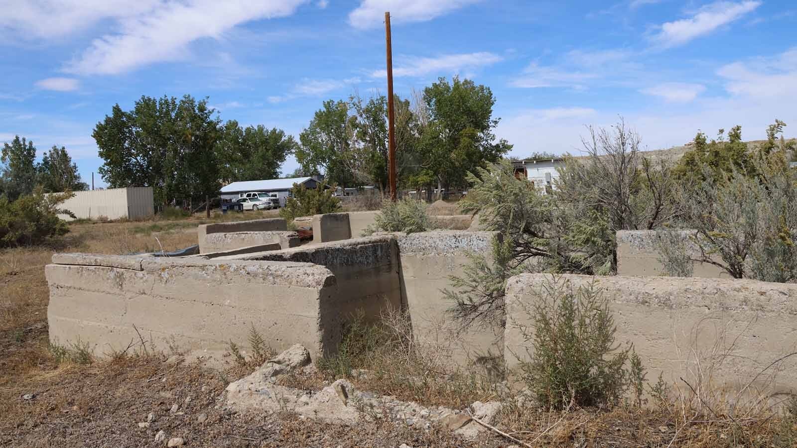 Foundations in the middle of the townsite on 1st Street are a reminder of the day when a nitroglycerine truck blew up in 1921 and cracked foundations in the townsite.