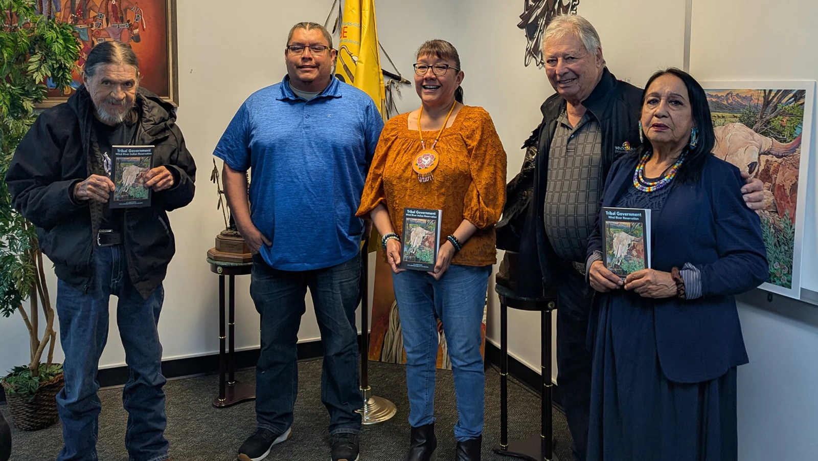 Scotty Ratliff, second from right, presents the tribal government book to the Shoshone Business Council.