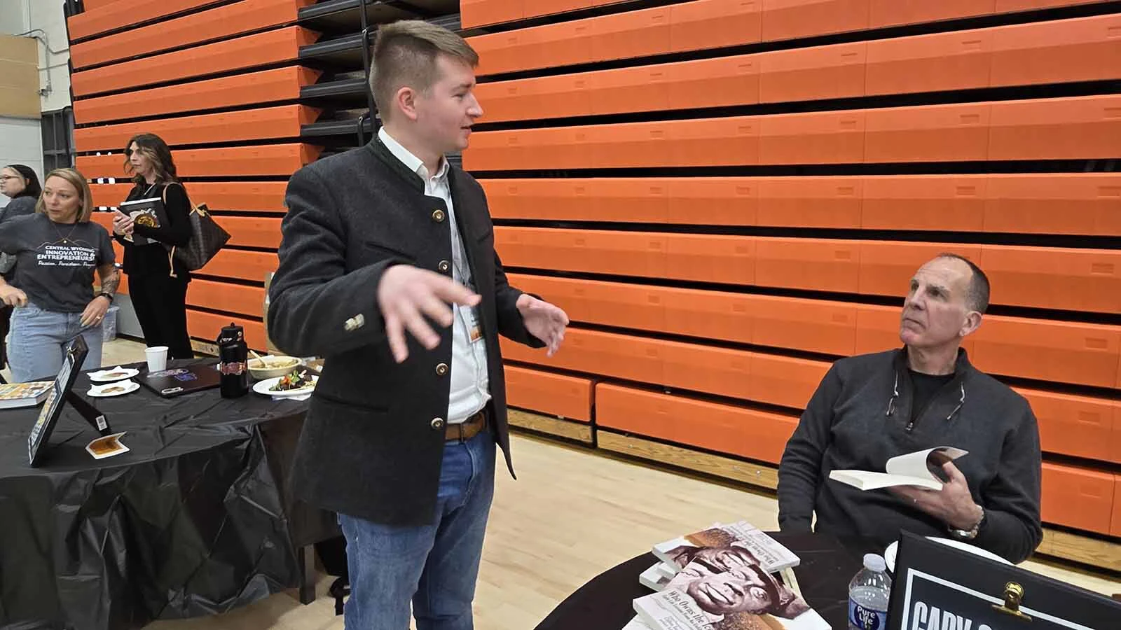 An entrepreneur from Germany, left, was among those attending the recent Central Wyoming College Innovation & Entrepreneur Conference. He started his business as a Wyoming LLC, and was explaining his concept to Gary Schoenig, a national business thought leader who was a keynote speaker during the event.