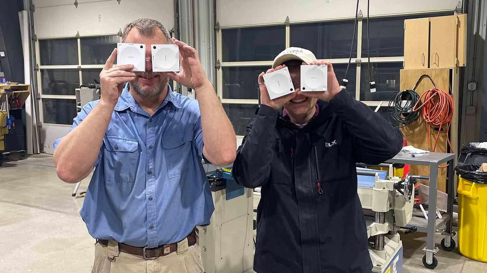 Greg Locke left with Power Theory founder Luke Macy hold sensors over their eyes.