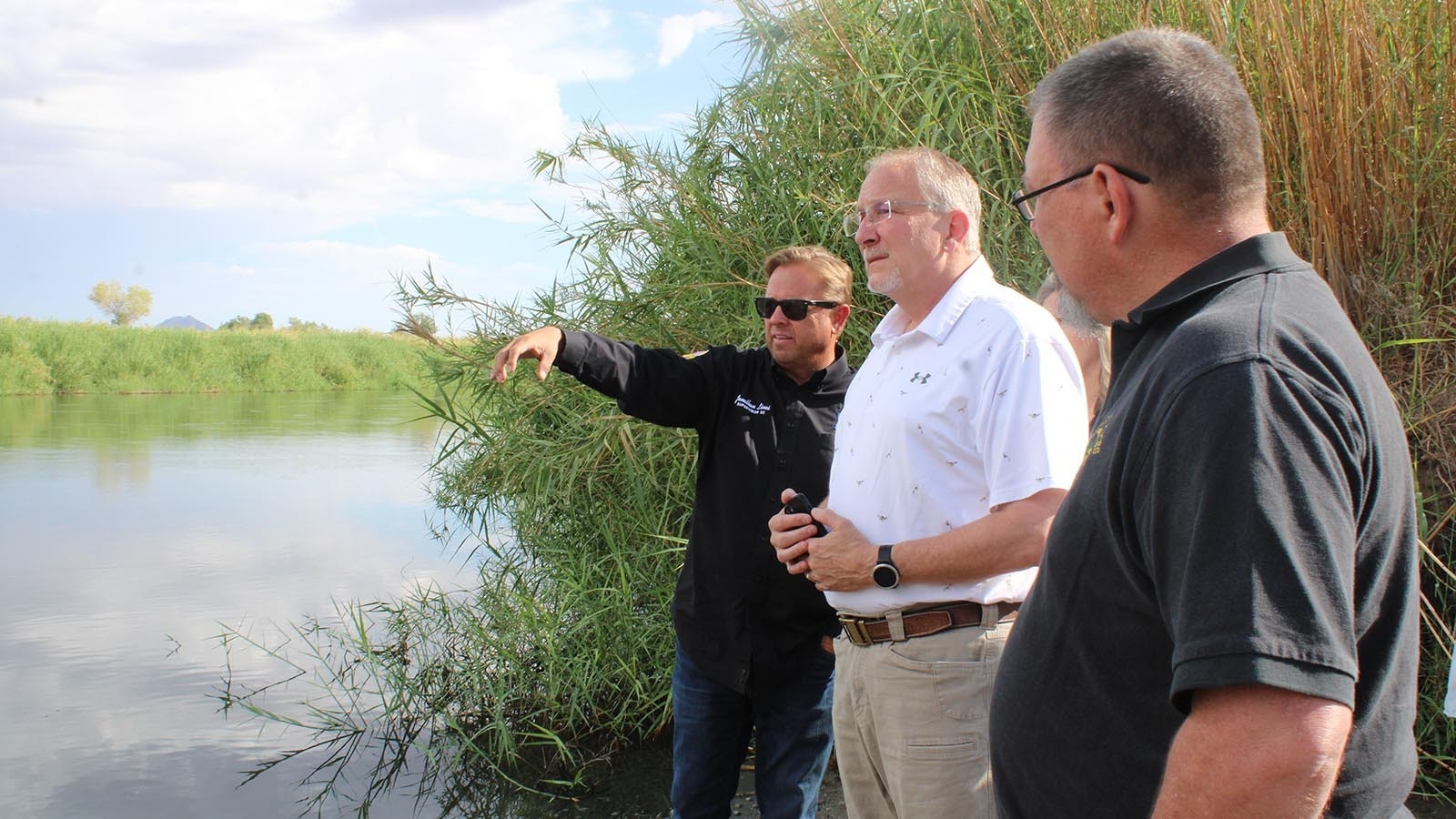 Yuma County Supervisor Jonathan Lines, from left, shows state Reps. Jon Conrad, R-Mountain View, and Tony Niemec, R-Green River, a junction between the California, Arizona and Mexico borders at the Colorado River that leads to many illegal crossings.