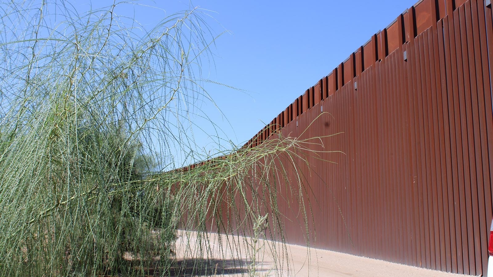 The southern border wall stretches around 400 miles and is about 30 feet tall, but a roughly 8-mile gap exists in the wall in Yuma, Arizona.