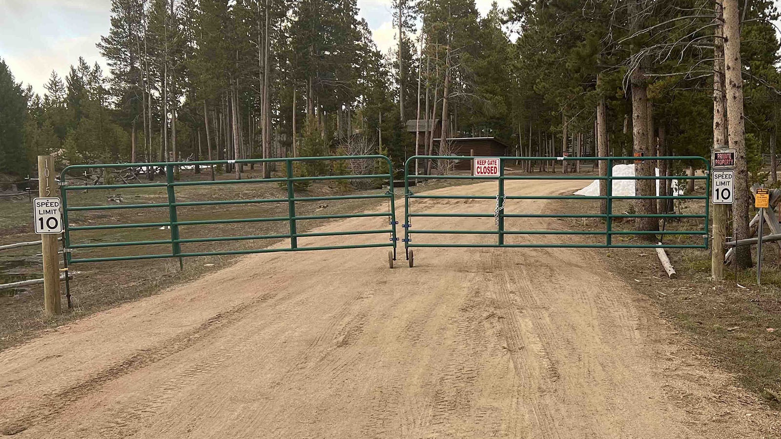 A locked gate blocks access to the west end of the Boswell Road, off Highway 230 in southern Albany County.