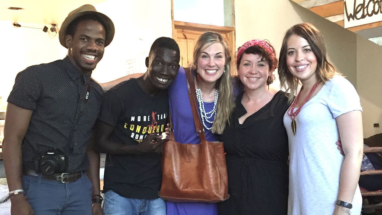 Emily Betzler, center from left, Jenae Neeson and Alison Meacham of the Bought Beautifully team visit with members of the 2nd Story Goods team during a visit to Haiti in 2017.