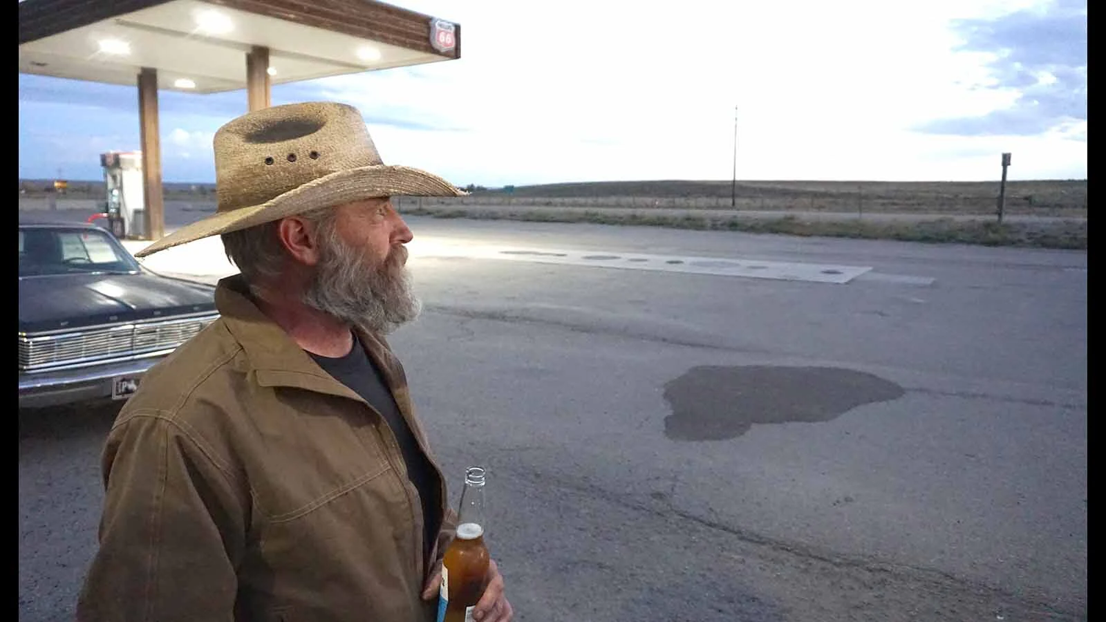 Third-generation Boulder Bar owner Burke Steele enjoys a cigar, a beer and his rusted 1965 Ford Galaxie when not running the bar.