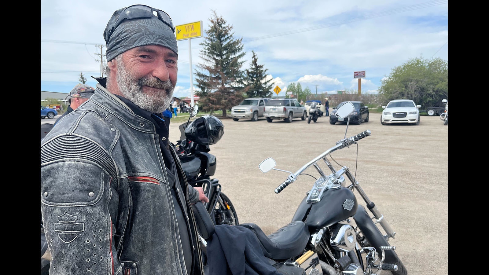 Heath Hetrick with "Alice," a 1991 Shoveled Harley-Davidson owned by Jim "Crash" Newman, a Pinedale motorcyclist who died by suicide. Hetrick rode Newman's hog in memory of his friend in the Boulder Poker Run.